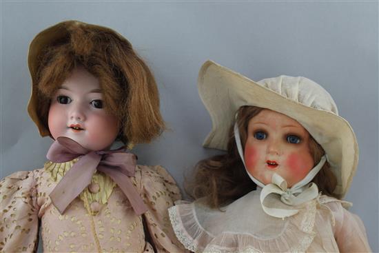 An Armand Marseille bisque headed doll & another doll
